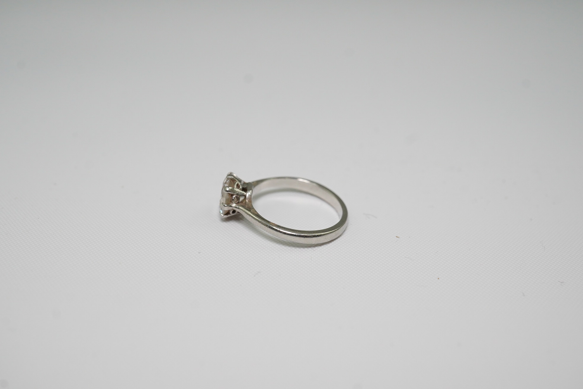 A platinum and solitaire diamond set ring
